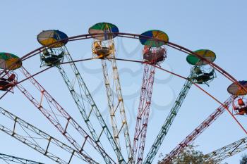 Ferris wheel on the blue sky background 
