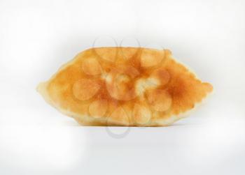 One oven baked pasty over white background. Looks delicious. 
