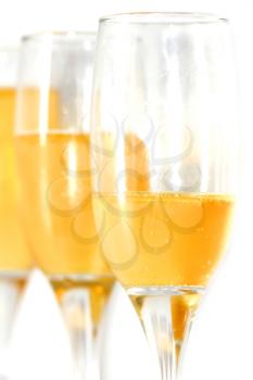 three glasses of champagne on a white background