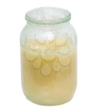 honey in a glass jar on a white background