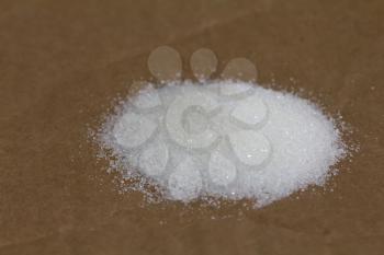 sugar on a cardboard background papers. macro...