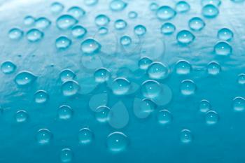 drops of water on a blue background. macro