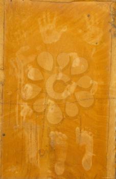 hand and foot prints on an orange background
