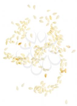 Sesame seeds scattered and isolated on white background
