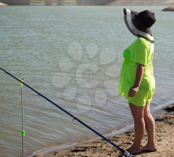 The girl is fishing for the bait .
