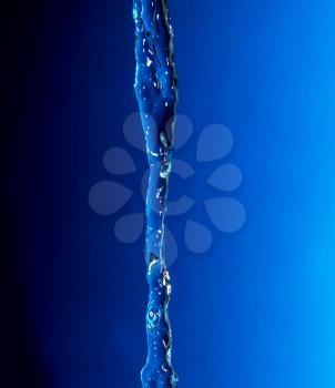 a jet of water on a blue background