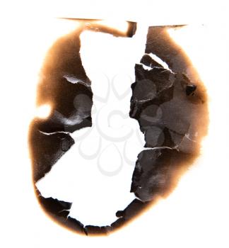 burned hole on a white paper background