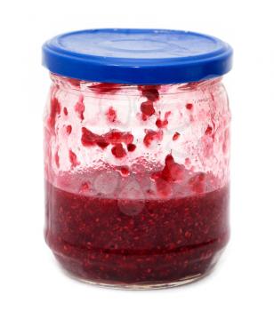 raspberry jam in a jar on a white background