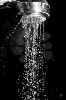Shower with water isolated on a black background