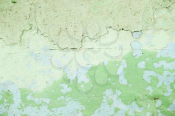 abstract background of old cracked green wall