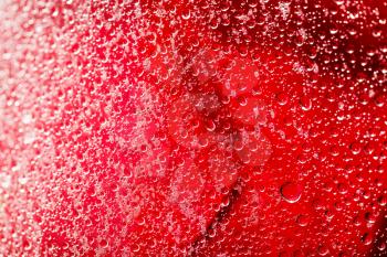 water droplets on a red background. macro