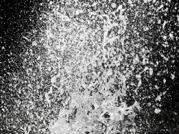 Abstract background. Splash of water in the form of rain on a black background