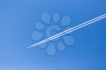 trace of an airplane in the blue sky