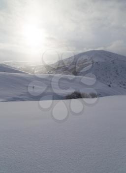 dawn sun in the snowy mountains of Kazakhstan