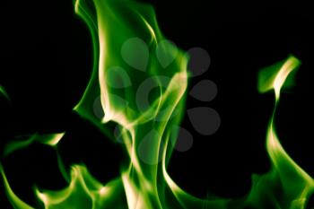 green flame fire on a black background
