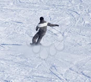 man snowboarding in the winter