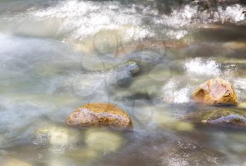 background of turbulent water in the mountain river