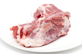 fresh meat in a dish on a white background