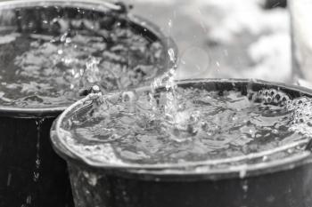 droplets in water in a bucket
