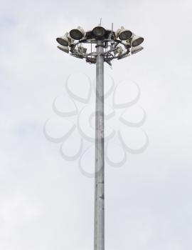 a large pillar with lights against the sky