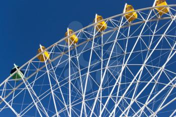Ferris wheel against the blue sky