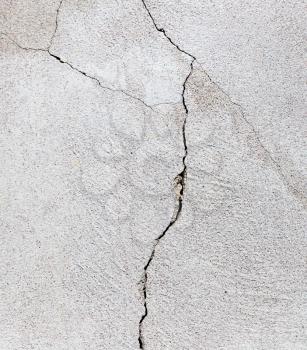 a crack in the concrete wall as background