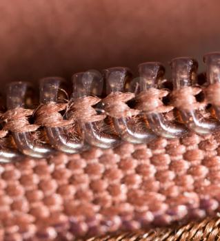 Zipper on clothing as a background. macro