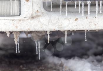 snow and icicles on cars in winter