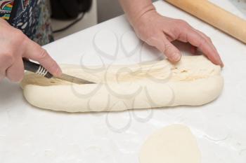 chef cuts dough