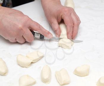 chef cuts dough