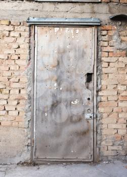 old door in a brick wall