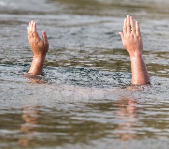 men's hands out of the water