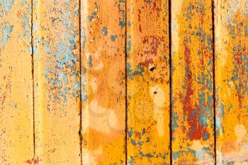 old yellow paint on the fence as a backdrop