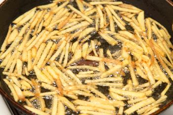 cooking potato fries in oil