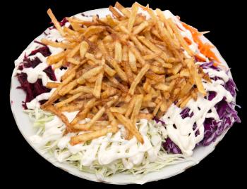 dish of fries with mayonnaise and vegetables on a black background