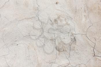 Old cracked concrete wall as a background .