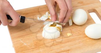 cook eggs on cutting board on a white background .
