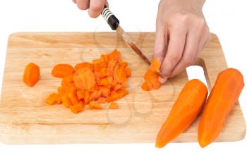cook cuts carrots on a white background .