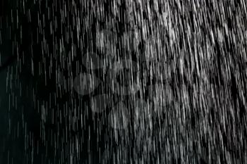 Abstract background of rain drops on a black background