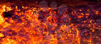 Abstract background of burning red coals. Texture