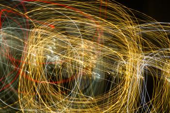 Abstract background of light bulbs at night in motion .