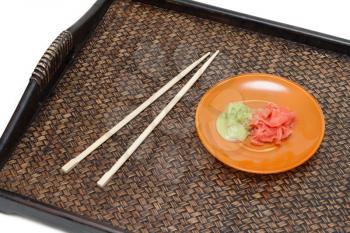 Royalty Free Photo of a Plate and Chopsticks on a Tray