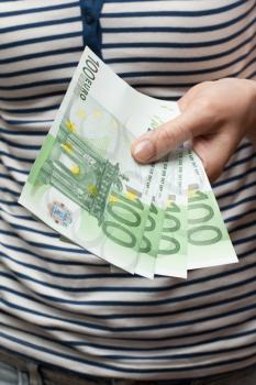 Royalty Free Photo of a Person Holding Euro Banknotes