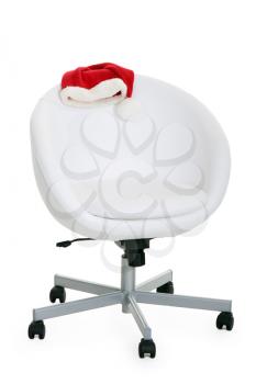 Royalty Free Photo of a Santa Hat on a Chair