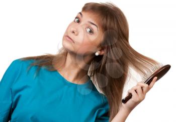 Royalty Free Photo of a Woman Brushing Her Hair