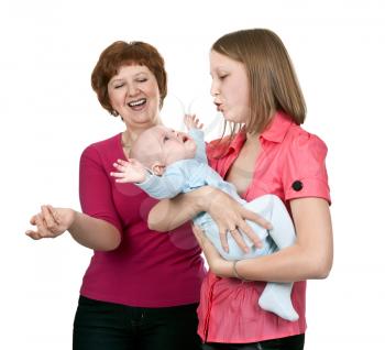 Royalty Free Photo of a Mother and Grandmother Soothing a Baby