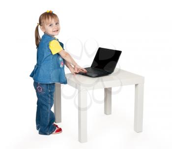 Royalty Free Photo of a Little Girl Using a Laptop