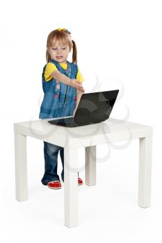 Royalty Free Photo of a Little Girl Using a Laptop
