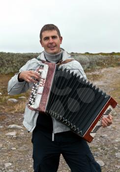 Royalty Free Photo of a Man Playing the Accordian