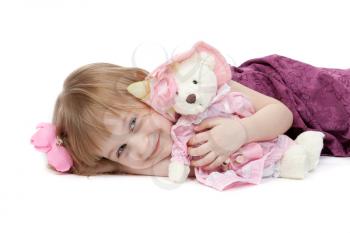 a little girl 4 years old with a plush toy bear isolated on white background